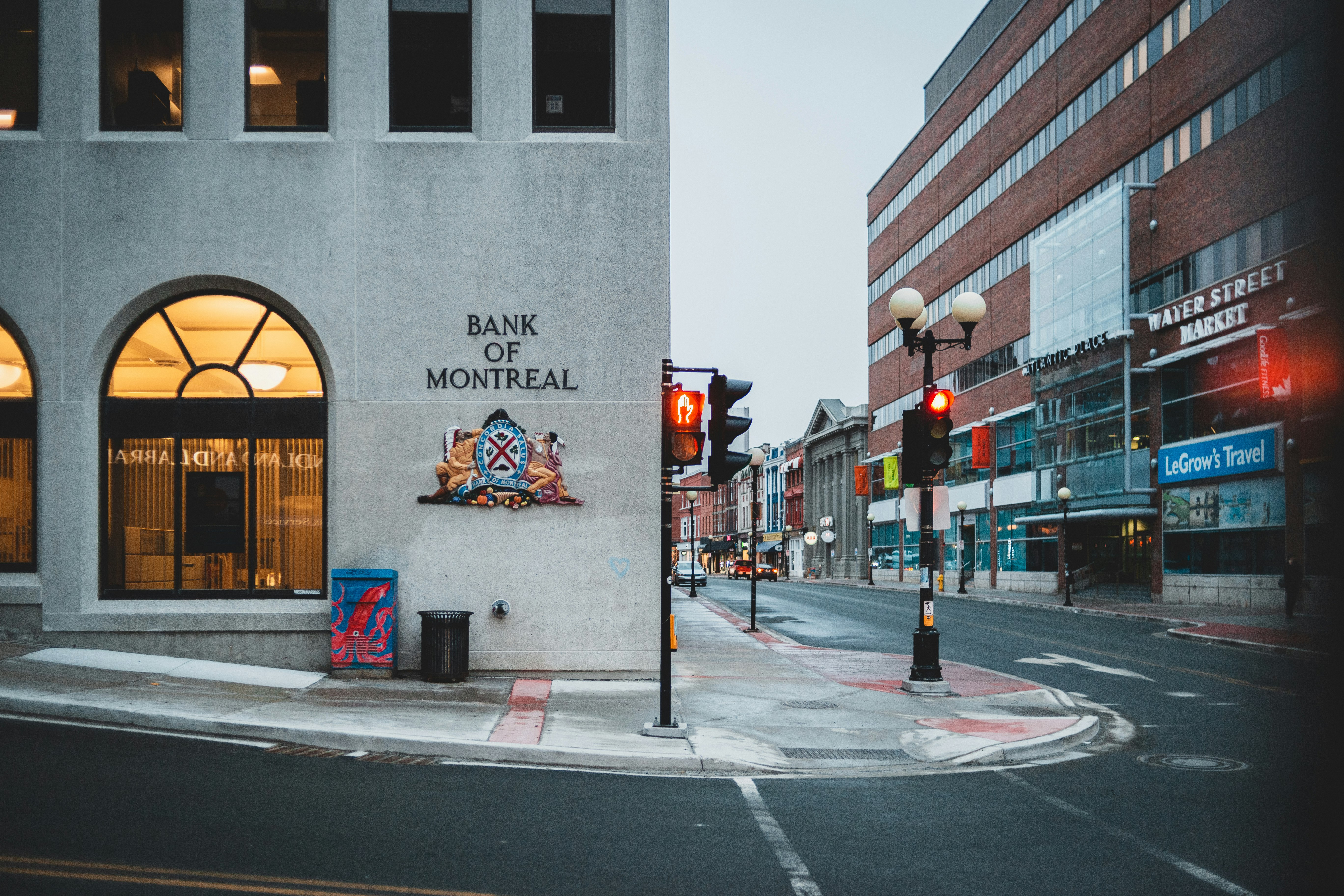 gray concrete building near pedestrian lane during daytime